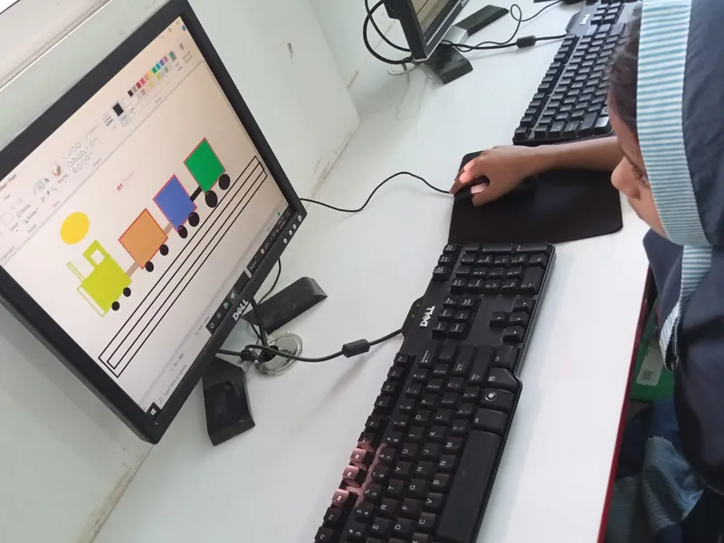 A young student's first block-coding project on screen