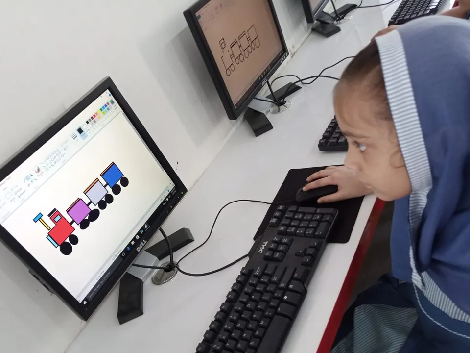 A young student building a block-coding project