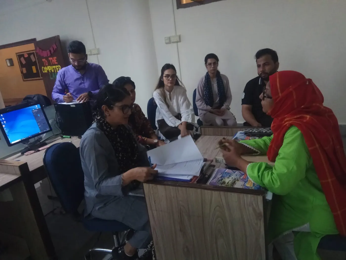 Technoknowledge team in discussion with teachers and school staff