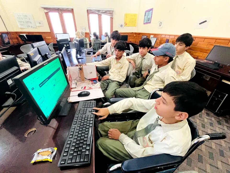 Students working on a robotics project in the computer lab